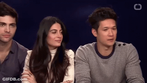 Man And Woman Sitting Next To Each Other GIF
