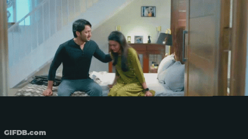 Man And Woman Sitting On Bed GIF