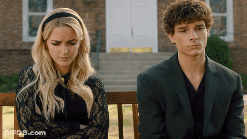 Man And Woman Sitting On Bench GIF
