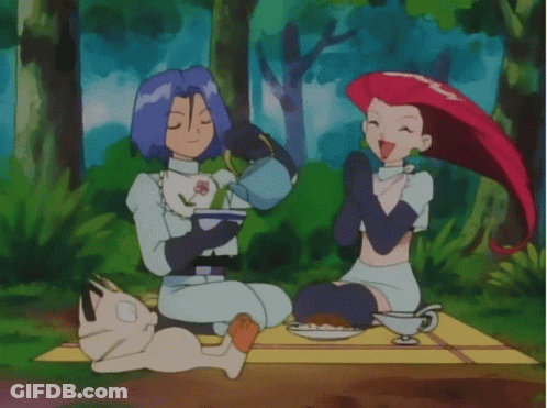 Man And Woman Sitting On Blanket Eating GIF