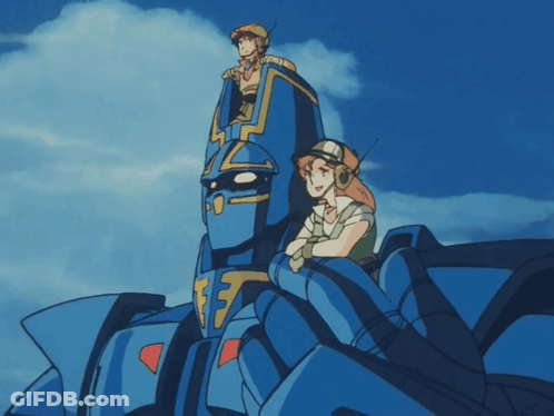 Man And Woman Sitting On Blue Robot Number 17 GIF