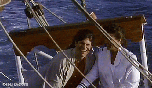 Man And Woman Sitting On Boat Smiling GIF