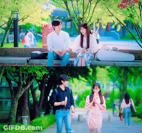 Man And Woman Sitting On Brick Wall GIF