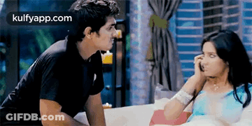 Man And Woman Sitting On Couch GIF