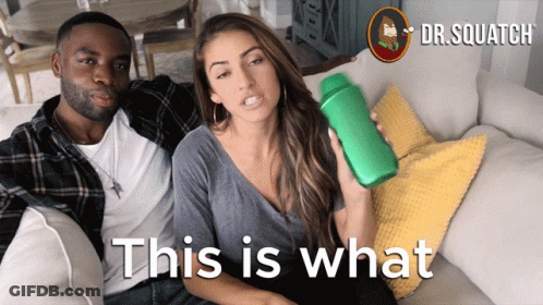 Man And Woman Sitting On Couch GIF