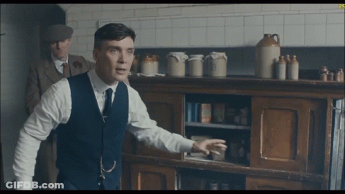 Man And Woman Sitting On Couch GIF