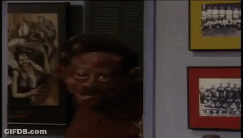 Man And Woman Sitting On Couch GIF