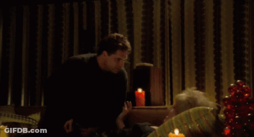 Man And Woman Sitting On Couch Leftover From Husband GIF