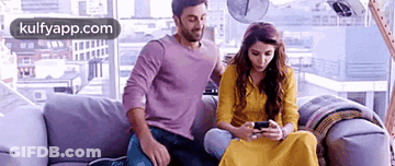 Man And Woman Sitting On Couch GIF