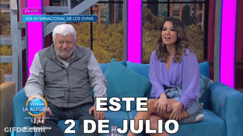 Man And Woman Sitting On Couch GIF