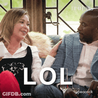Man And Woman Sitting On Couch Saying LOL GIF
