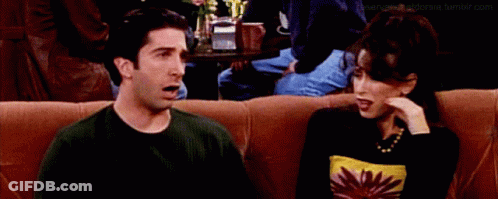 Man And Woman Sitting On Couch Saying Oh GIF