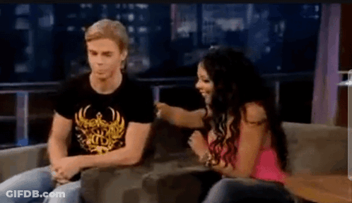Man And Woman Sitting On Couch Talking GIF
