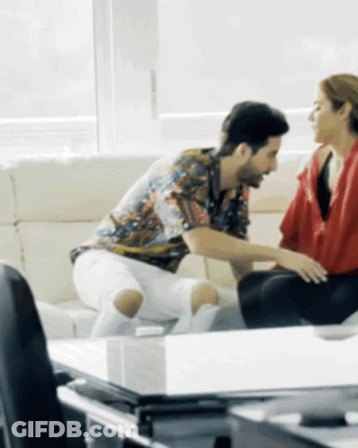 Man And Woman Sitting On Couch Talking GIF