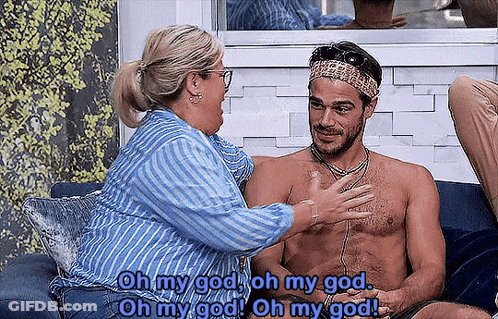 Man And Woman Sitting On Couch GIF