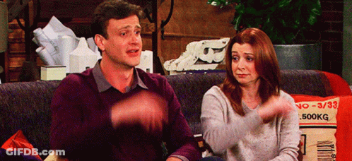 Man And Woman Sitting On Couch With 500Kg Pillow GIF