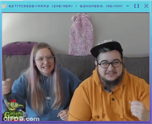 Man And Woman Sitting On Couch With Gallant Goblin Screen GIF
