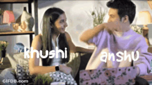 Man And Woman Sitting On Couch With Khushi And Anshu Above GIF