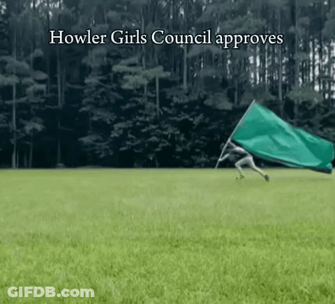 Man And Woman Sitting On Couch With Smosh Sign GIF