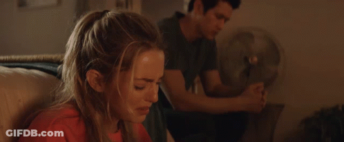 Man And Woman Sitting On Couch Woman Covering Mouth GIF