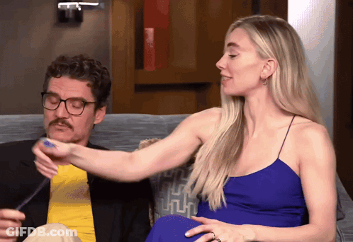 Man And Woman Sitting On Couch Woman Holding Arm GIF