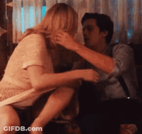 Man And Woman Sitting On Couch Woman Taking Off Shirt GIF