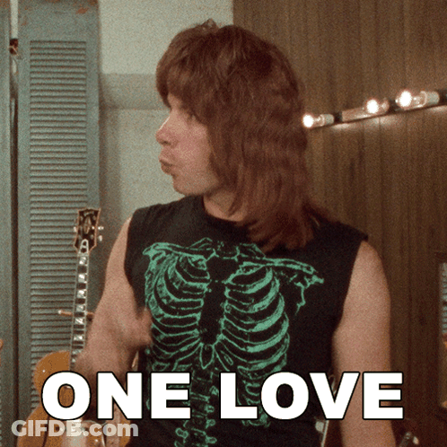 Man And Woman Sitting On Couch GIF