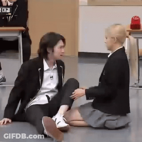 Man And Woman Sitting On Floor Holding Hands GIF