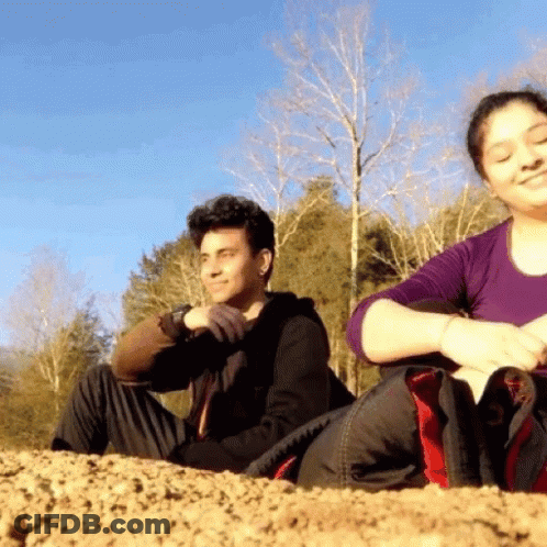 Man And Woman Sitting On Hill GIF