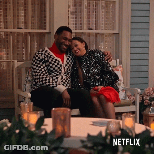 Man And Woman Sitting On Porch With Netflix Logo GIF