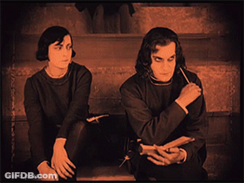 Man And Woman Sitting On Stairs GIF