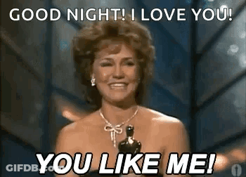 Man And Woman Sitting Saying We Love This One GIF