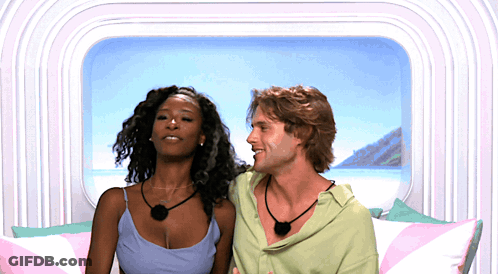 Man And Woman Sitting Smiling GIF