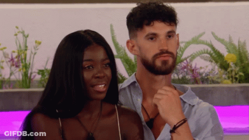 Man And Woman Sitting Smiling GIF