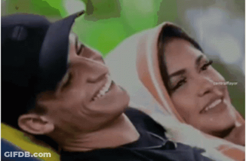 Man And Woman Sitting Smiling Woman Wearing Hijab GIF