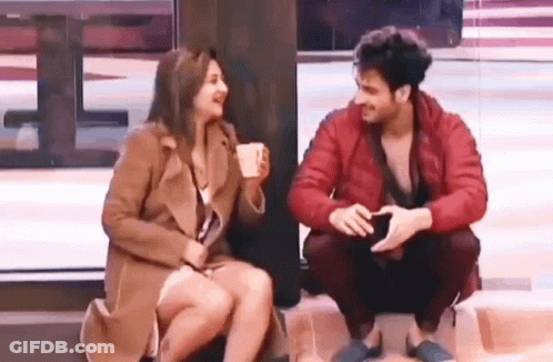 Man And Woman Sitting Together GIF