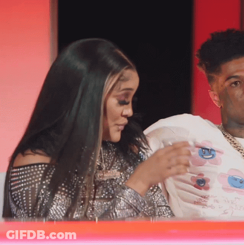 Man And Woman Sitting Together Woman In Floral White Shirt GIF