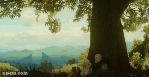 Man And Woman Sitting Under Tree With Mountains GIF