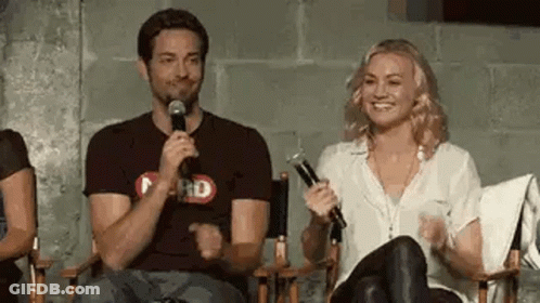 Man And Woman Sitting With Microphones GIF