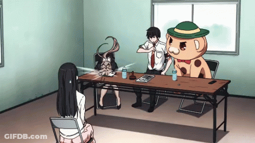 Man And Woman Sitting With Stuffed Animal In Green Hat GIF