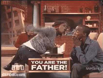 Man And Woman Sitting With You Are The Father Sign GIF