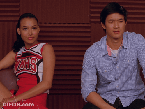 Man And Woman Sitting, Woman In WMHS Cheerleader Uniform GIF