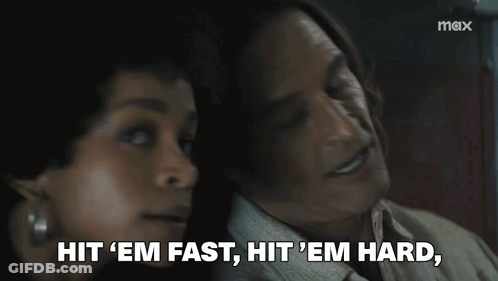 Man And Woman Sitting Woman Saying Hit Em Fast Hit Em Hard GIF