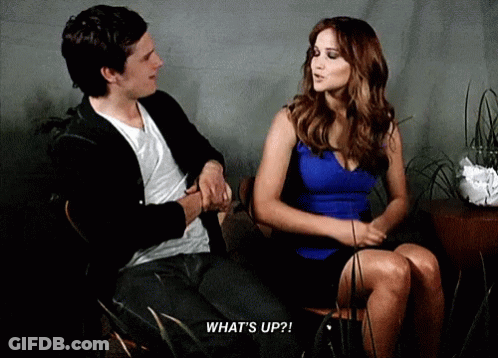 Man And Woman Sitting Woman Saying What's Up GIF