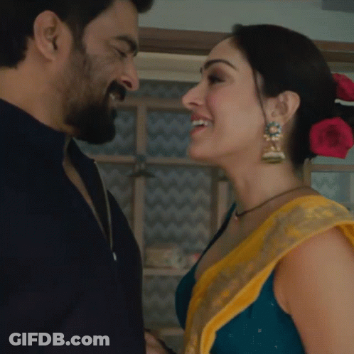 Man And Woman Smiling At Each Other GIF