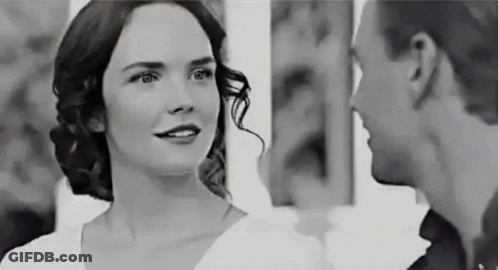 Man And Woman Smiling At Each Other GIF