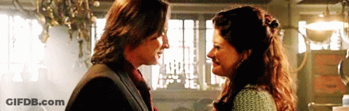 Man And Woman Smiling At Each Other GIF
