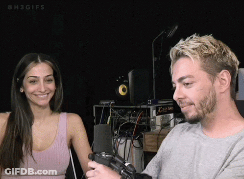 Man And Woman Smiling At Microphone Saying H3GIFs GIF
