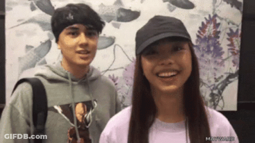 Man And Woman Smiling For Camera GIF