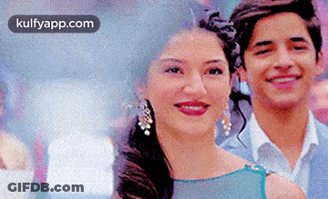 Man And Woman Smiling For Photo GIF